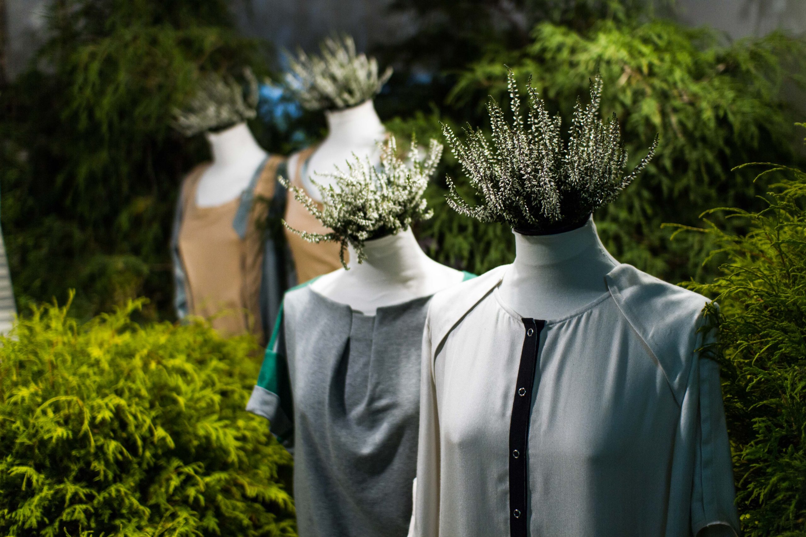 White,Mannequins,,,With,Heather,On,A,Dark,Green,Forest